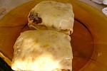 Фото рецепта: Фаршированные блины, запеченные под сыром